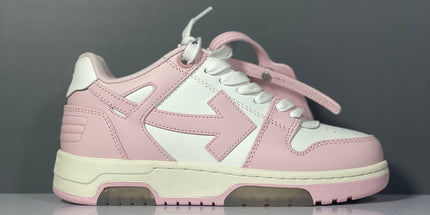 Pink and white off-white arrow daddy sneakers featuring a bold arrow logo on the side for 2023 trends
