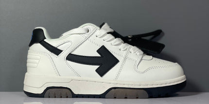 White leather off-white arrow daddy sneakers with black arrow logo matching laces and chunky sole