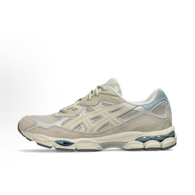Beige sneaker with mesh texture, light blue accents, and a white and gray sole.