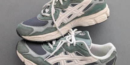 Green and gray sneakers with white laces and logo, featuring a textured mesh and suede design.