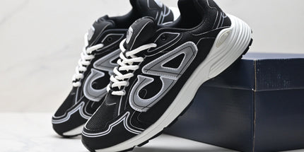 Black and white sneakers on a light gray background