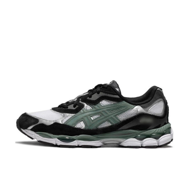 Black, white, and green sneaker with mesh panels, black laces, and a patterned sole.