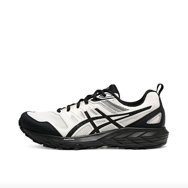 White and black athletic shoe with mesh upper, black sole, and logo stripe on the side.