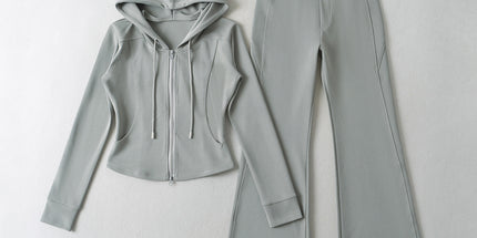 Light gray hoodie and pants set on a white background