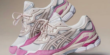 Pink and white sneakers with mesh fabric, beige accents, and curved gray patterns on a beige background.