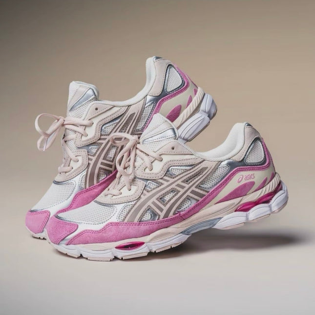 Pink and white sneakers with mesh fabric, beige accents, and curved gray patterns on a beige background.