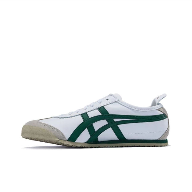White sneaker with green stripes and beige toe cap, side view on a white background.
