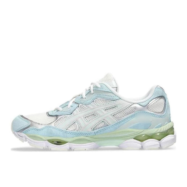 White sneaker with light blue accents, mesh panels, and a green-tinted sole.