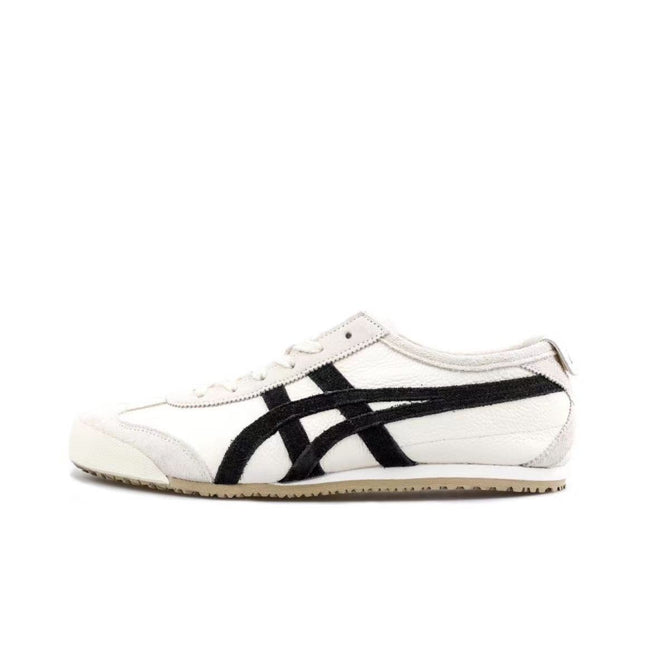 White sneaker with black stripes, beige sole, and a low-top design.