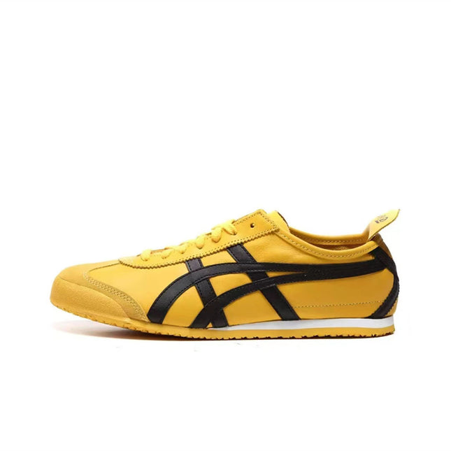 Yellow sneaker with black stripes, white sole, and lace-up design on a plain white background.