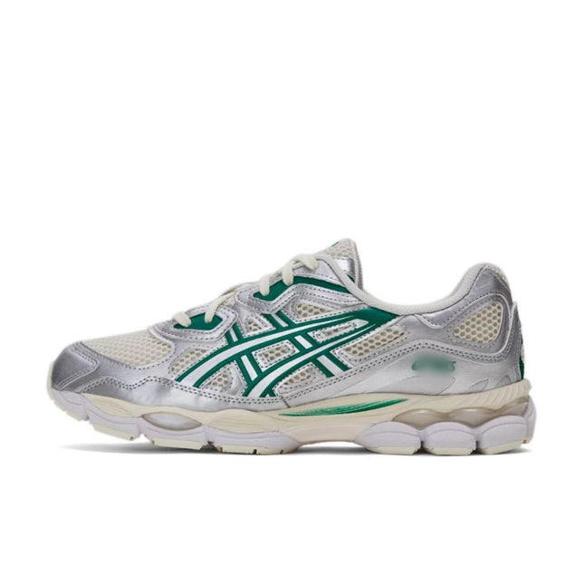 Silver and white sneaker with green stripes, white laces, and a textured sole.