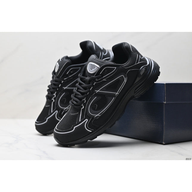 Black sneakers with white accents on a light gray background