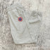 Gray pants with red label / M