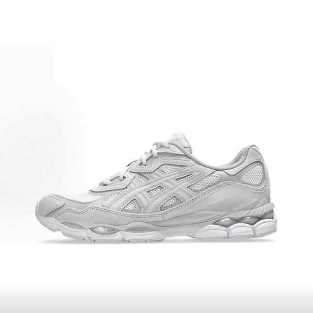 Gray athletic shoe with mesh and leather detailing on a white background.