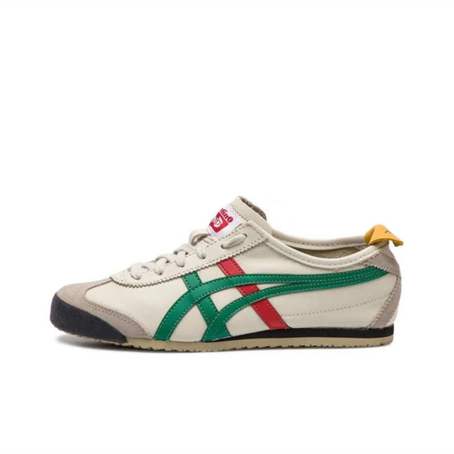 Cream sneaker with green and red stripes, beige suede accents, and a yellow heel tab.