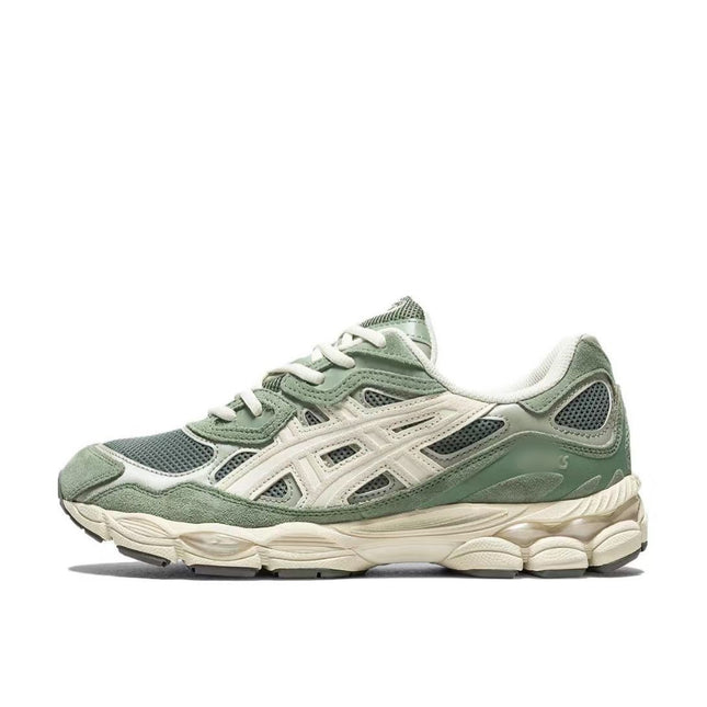 Green and white sneaker with mesh and suede textures, cream sole, and distinctive side stripes.