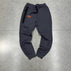 M / Dark grey trousers