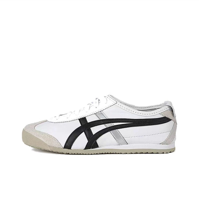 White sneaker with black stripes and beige sole, featuring gray accents and lace-up design.